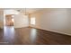 Bright living room featuring hardwood floors, vaulted ceilings, and a large window at 33055 N Madison Way Dr, San Tan Valley, AZ 85144