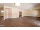 Spacious living room with wood-look floors and neutral paint, ready for your personal touch and decor at 33055 N Madison Way Dr, San Tan Valley, AZ 85144
