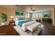 The main bedroom features a ceiling fan, natural light, and modern furnishings at 33055 N Madison Way Dr, San Tan Valley, AZ 85144