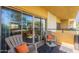 Relaxing balcony area featuring stylish chairs, a table, and a sliding glass door view at 3600 N 5Th Ave # 302, Phoenix, AZ 85013