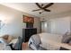Bedroom with ceiling fan, TV, bed with neutral colored comforter, and desk at 3600 N 5Th Ave # 302, Phoenix, AZ 85013