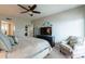 Cozy bedroom features a fan, television, and in-unit washer/dryer at 3600 N 5Th Ave # 302, Phoenix, AZ 85013
