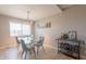 Bright dining area with modern light fixture and bar cart, perfect for entertaining guests at 3600 N 5Th Ave # 302, Phoenix, AZ 85013