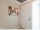 Clean hallway with a door and painting adding a touch of elegance to the space at 3600 N 5Th Ave # 302, Phoenix, AZ 85013