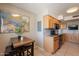 Kitchen nook with wooden table, breakfast bar, and stainless steel appliances at 3600 N 5Th Ave # 302, Phoenix, AZ 85013