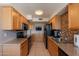 Bright kitchen features wood cabinets, granite countertops, and stainless steel appliances at 3600 N 5Th Ave # 302, Phoenix, AZ 85013