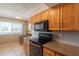 Bright kitchen features wood cabinets, granite countertops, and stainless steel appliances at 3600 N 5Th Ave # 302, Phoenix, AZ 85013