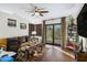 Cozy living room with hardwood floors, neutral colors, and sliding glass doors at 36389 N 105Th Pl, Scottsdale, AZ 85262