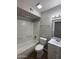 Bathroom with a shower and tub combination, and white vanity with sink at 3749 W Gelding Dr, Phoenix, AZ 85053