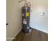 Corner view of a new water heater in a room with modern wood look flooring at 3749 W Gelding Dr, Phoenix, AZ 85053