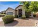 Inviting front of home with a low maintenance yard and gray garage door at 4314 E Anderson Dr, Phoenix, AZ 85032