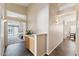 Bright hallway with tile floors, leading to a bedroom and dining area at 4314 E Anderson Dr, Phoenix, AZ 85032