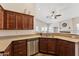 Modern kitchen design with stainless steel appliances, granite counters and wooden cabinets at 4314 E Anderson Dr, Phoenix, AZ 85032