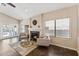 Bright living room featuring a cozy fireplace, tile floors, and French doors to the pool at 4314 E Anderson Dr, Phoenix, AZ 85032
