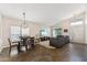 Open-concept living space with a dining area, cozy seating and lots of natural light at 4314 E Anderson Dr, Phoenix, AZ 85032