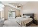 Spacious main bedroom with vaulted ceilings, ceiling fan, and sliding door access to the pool at 4314 E Anderson Dr, Phoenix, AZ 85032