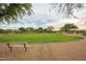 Neighborhood park featuring a grass field and bench under mature trees at 4314 E Anderson Dr, Phoenix, AZ 85032