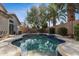 Backyard showcasing a sparkling pool with tile trim and mature landscaping around the perimeter at 4314 E Anderson Dr, Phoenix, AZ 85032