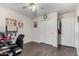 Bedroom featuring laminate flooring, closet with sliding doors, and a ceiling fan at 44976 W Miramar Rd, Maricopa, AZ 85139