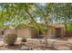 Charming single-story home with a two-car garage, drought-tolerant landscaping, and mature shade trees at 44976 W Miramar Rd, Maricopa, AZ 85139