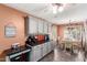 Well-designed kitchen with ample counter space, stylish cabinets, and adjacent dining area at 44976 W Miramar Rd, Maricopa, AZ 85139