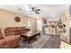 Cozy living room featuring tile floors, neutral walls, and an open layout to the breakfast bar at 44976 W Miramar Rd, Maricopa, AZ 85139