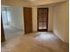 Spacious bedroom featuring a secondary exit door and neutral carpeting at 4801 E Sheena Dr, Scottsdale, AZ 85254