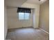 Bright bedroom featuring neutral walls and carpet, ready for a personalized touch at 4801 E Sheena Dr, Scottsdale, AZ 85254