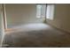 Bedroom under renovation featuring bare flooring and paint-ready walls at 4801 E Sheena Dr, Scottsdale, AZ 85254