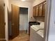 Well-organized laundry room with ample storage and modern appliances at 4801 E Sheena Dr, Scottsdale, AZ 85254