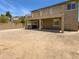 Large backyard featuring a covered patio, upstairs deck, privacy wall, and potential for landscaping at 5140 W Bent Tree Dr, Phoenix, AZ 85083