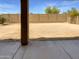 View from covered patio showcasing a large backyard space and a tall brick wall for privacy at 5140 W Bent Tree Dr, Phoenix, AZ 85083