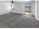 Spacious bedroom with plush carpeting, offering picturesque mountain views through windows and a sliding door at 5140 W Bent Tree Dr, Phoenix, AZ 85083