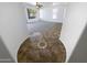 Hallway showing tile flooring with a decorative inlay and access to a carpeted room at 5140 W Bent Tree Dr, Phoenix, AZ 85083