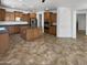 Expansive kitchen featuring stainless steel appliances and an island, ideal for culinary enthusiasts at 5140 W Bent Tree Dr, Phoenix, AZ 85083