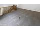 Open loft area with neutral carpeting and wooden banister overlooking the stairway at 5140 W Bent Tree Dr, Phoenix, AZ 85083