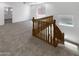 Bright and open loft space with neutral carpet and railing overlooking the staircase and windows at 5140 W Bent Tree Dr, Phoenix, AZ 85083