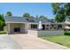Attractive home featuring a carport and well-kept lawn at 6302 N 13Th Pl, Phoenix, AZ 85014
