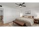 Spacious bedroom features a comfortable bed, modern artwork, large closet, and a ceiling fan for optimal comfort at 6302 N 13Th Pl, Phoenix, AZ 85014