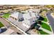 Aerial view of a luxury home with a sports court, pool, lush landscaping, and a multi-car garage at 7482 S Mccormick Way, Queen Creek, AZ 85142