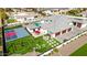 Aerial view displays an estate with a basketball court, putting green, and spacious three-car garage, offering luxury and recreation at 7482 S Mccormick Way, Queen Creek, AZ 85142