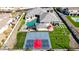An aerial view showcases a large home, sparkling pool, and basketball court, offering a blend of luxury and recreational amenities at 7482 S Mccormick Way, Queen Creek, AZ 85142