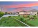 Spacious backyard featuring a tennis court, putting green, and outdoor entertaining area at 7482 S Mccormick Way, Queen Creek, AZ 85142