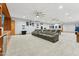 Spacious carpeted basement with a bar area, pool table, and seating area at 7482 S Mccormick Way, Queen Creek, AZ 85142