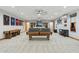 Large basement with a pool table, bar seating, sports memorabilia, and a cozy entertainment area at 7482 S Mccormick Way, Queen Creek, AZ 85142