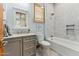 Bright bathroom with a tub/shower combo and a gray vanity with marble countertop at 7482 S Mccormick Way, Queen Creek, AZ 85142
