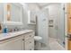 Bright bathroom featuring marble countertop vanity, undermount sink, and glass door shower at 7482 S Mccormick Way, Queen Creek, AZ 85142