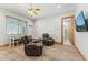 This flex space has two reclining chairs, a ceiling fan and is connected to a bathroom at 7482 S Mccormick Way, Queen Creek, AZ 85142