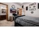 Comfortable bedroom features a walk-in closet, a wooden desk, and a large clock on the wall at 7482 S Mccormick Way, Queen Creek, AZ 85142