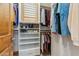 Walk-in closet with shelves and hanging racks, providing ample storage space at 7482 S Mccormick Way, Queen Creek, AZ 85142